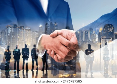 Double exposure of business handshake for successful of investment deal and city night background, teamwork and partnership concept.: stockfoto