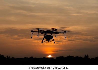 Drone flying on the sky evening sunset look Arkistovalokuva