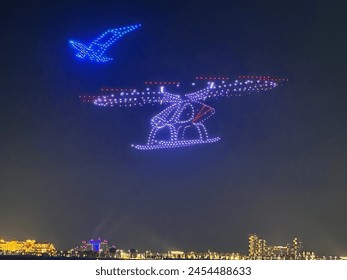 DUBAI, UAE - DEC 27: 2024 DSF Drones Show presented by Emarat Petroleum at Bluewaters Island in Dubai, UAE, as seen on Dec 27, 2023.: redactionele stockfoto