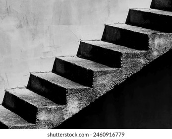 Ethereal Transitions. The Concrete Staircase in Architectural Harmony. Duality concept. Black and white, monochrome. 库存照片