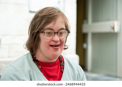 Expressive portrait of a 41 yo woman with the Down Syndrome, Tienen, Flanders, Belgium Stock-foto