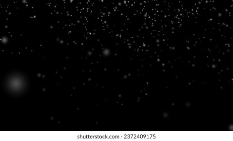 黒い背景に雪が降る。高品質写真の写真素材