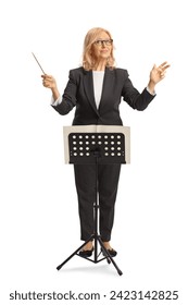 Female conductor behind a music note stand isolated on white background Stockfoto