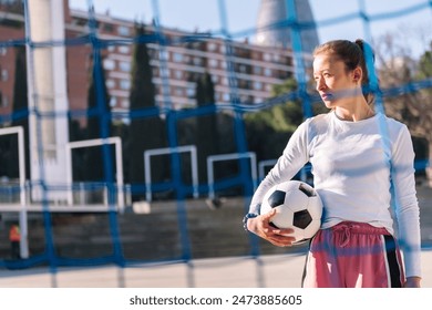 female soccer player holding a soccer ball Arkistovalokuva