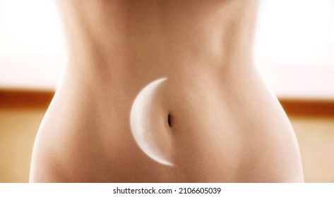 Female stomach with moon multiple exposure image. Menstruation and woman health concept. Foto stock