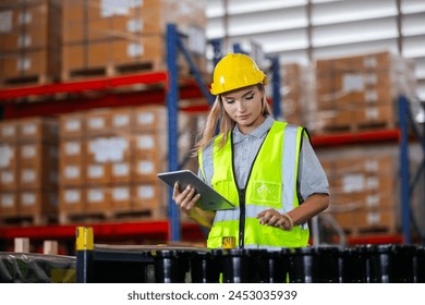Female professional using tablet quality checking car parts worker in warehouse. Supervisor import-export shipping transportation, logistic business factory concept. – Ảnh có sẵn