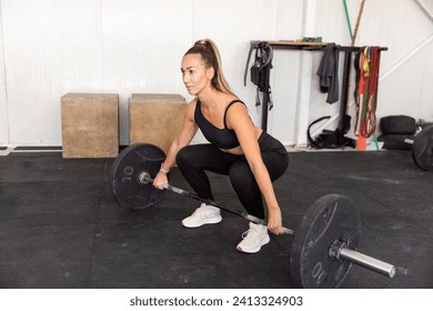 Fitness woman lifting barbell in the gym Foto stock