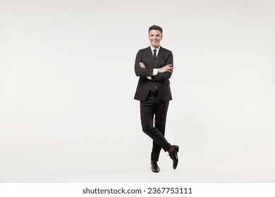 Full length young successful employee business corporate lawyer man 20s wearing classic formal black grey suit shirt tie work in office hold hands crossed folded isolated on white background studio, fotografie de stoc