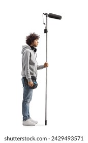 Full length profile shot of a boom operator holding a microphone isolated on white background: stockfoto
