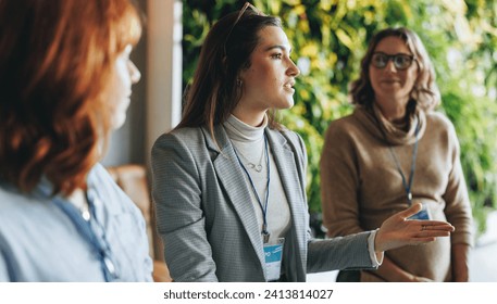 Group of business women engaged in a productive discussion. Colleagues working in a professional environment, part of a panel conference. The focus is on effective communication and networking skills. Adlı Stok Fotoğraf