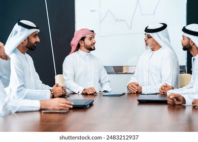 Group of corporate arab businessmen meeting in the office - Middle-eastern businesspeople wearing emirati kandora working in a meeting room, Dubai Arkistovalokuva