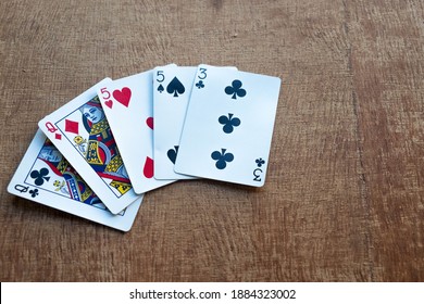The hand rankings of poker cards are used for learning purposes. (Three of a kind) ภาพถ่ายสต็อก