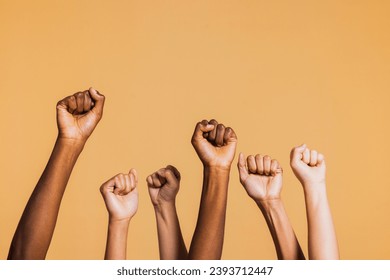 Hands raised with closed fists. Diverse coloured hands raised up with closed fist symbolizing power, determination. – Ảnh có sẵn