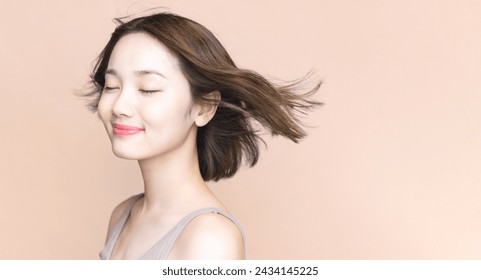 Hair care concept of young Asian woman. Beauty salon. Cosmetics. Foto stock