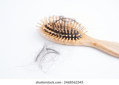 Hair loss fall with comb brush isolated on white background. Arkistovalokuva