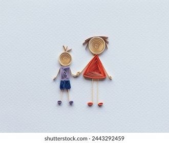 Happy family with mother and son holding hands together. family stick figure. parents and children. Hand made of paper quilling technique. handicraft at home, card craft, Business concept. Stock-foto