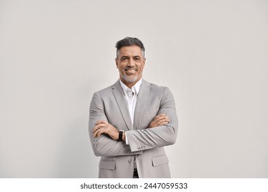 Happy middle aged business man ceo entrepreneur in suit, smiling 45 years old professional executive manager, confident businessman looking at camera standing arms crossed isolated on white, portrait. Foto stock