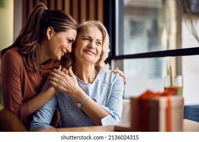 Happy senior woman enjoying in daughter's affection on Mother's day. Stock Photo