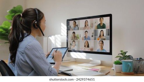 Happy smile asia young talent woman learn mba college class on webcam video call in desktop screen with cowork friend workforce group talk in sale report. Smart job work at home for staff workspace. స్టాక్ ఫోటో