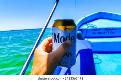 Holbox island in Quintana Roo Mexico 16. May 2022 Drinking a can of cold beer Modelo Especial on the boat at beach in paradise on Isla Holbox island in Quintana Roo Mexico.: dziennikarskie zdjęcie stockowe