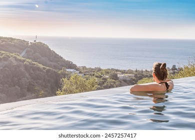 Infinity pool, swimming pool with amazing view, mediterranean sea, nature, olive trees, hills, sunset, relax, wellness. Crete, greek island, Greece, Europe. Greek holiday, vacation in Greece. , fotografie de stoc