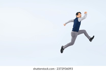 Jumping Middle aged Asian man. Stockfoto