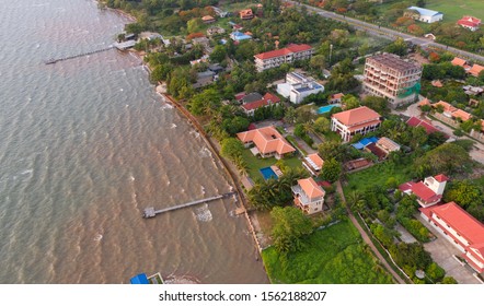 Kep city / Cambodia - May 20 2019 : aerial of Kep beach with crab market and small town Redaktionelt stock-foto