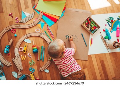 Kids draw and make crafts. Children with educational toys and school supplies for creativity. Background for preschool and kindergarten or art classes. Boy and girl play at home or daycare Foto stock