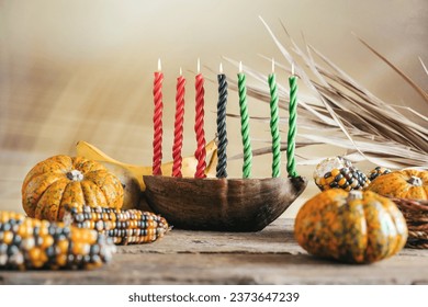 Kwanzaa, african holiday Kwanzaa with decoration of seven candles in red, black and green colors, vegetable harvest, corn. Greeting card banner. Happy Kwanzaa: stockfoto