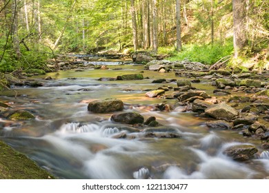 A long exposure of a small river deep in the woods of Pohorje, Sloveniaの写真素材