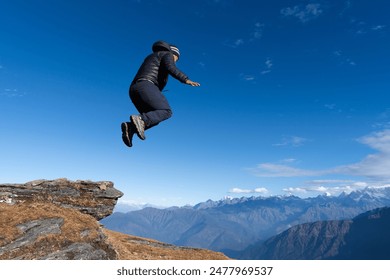 Man enjoying jumping in the nature, Himalayas and clear blue-sky background. Enjoying, jumping, leap, lifestyle Foto stock