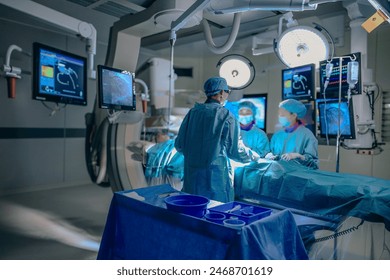 Medical Team Performing Surgical Operation in Modern Operating Room. Group of surgeons at operation in operating room at hospital. Arkistovalokuva