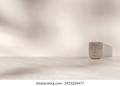 Minimal neutral product background, podium shelf, empty beige marble tabletop with concrete candle, plaster textured wall with natural abstract sun light shadows., fotografie de stoc
