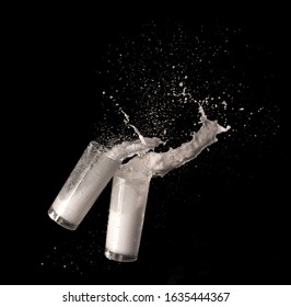 Milk splashing from glass isolated on black backgroundの写真素材