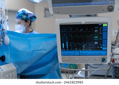 Monitor screen with vital sign and ECG data of patient during surgery inside operating room in hospital.Monitor people under anesthesia. showing patient heart rate and blood pressure Stockfoto
