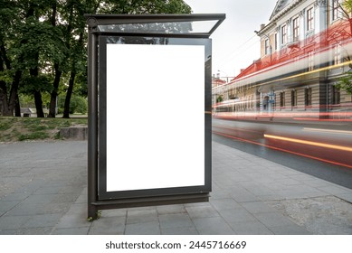 Mockup Of Bus Stop Billboard Display. Outdoor Advertising Poster Lightbox With Bright Car Light Trails On The City Street ภาพถ่ายสต็อก