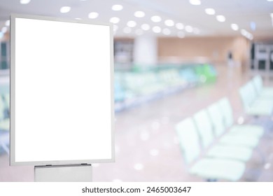 A mockup of an empty white poster on the wall in modern hospital waiting room with comfortable chairs and medical equipment. empty white blank poster on white wall in hospital, white board Stockfoto