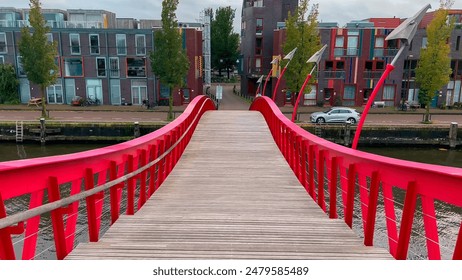 Modern footbridge Python Bridge at Eastern Docklands neighborhood of Amsterdam Netherlands October 20, 2023.  Toimituksellinen arkistovalokuva