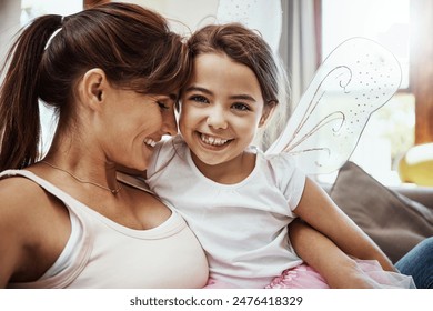 Mother, girl and happy on selfie on couch for memories, fun and care with support for child development. Parent, kid and smile in living room on sofa for social media, bonding and home with butterfly 库存照片