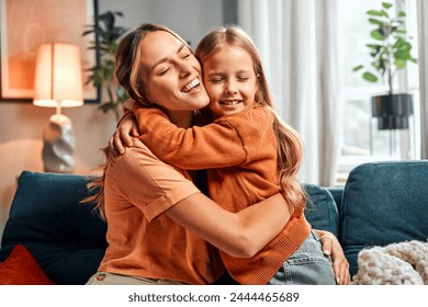 Стоковая фотография: Mother and daughter connection. Emotional kid hugging tightly beautiful mommy for expressing pure feelings. Beautiful woman demonstrating unconditional love for child while spending time together.