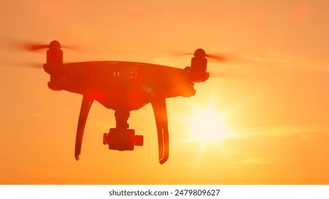 MUNICH, GERMANY, MAY 2ND 2024: Quadcopter drone flying towards camera at golden sunset: redactionele stockfoto