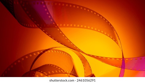 multi-colored background with real movie tape. cinema background for film production, film festivals, premieres, ticket announcements, flyers. Foto stock