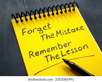 Notebook with motivation quote forget the mistake remember the lesson. Stock fotografie