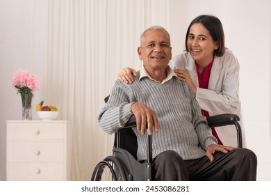 Nurse taking care of the senior patient sitting on wheel chair 库存照片