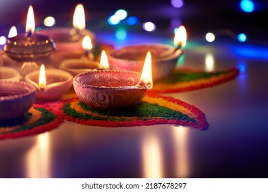 Oil lamps lit on street at night during diwali celebration Stock Photo