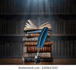 Old books ,quill pen and vintage inkwell on wooden desk in old library. Ancient books historical background. Retro style. Conceptual background on history, education, literature topics.
 Stock-foto