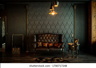 Old vintage interior with leather sofa, wood table and ceiling light. Stock Photo