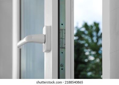 Open window with white plastic frame indoors, closeup Arkistovalokuva