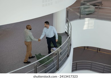 Overhead shot of people meeting in an office Arkistovalokuva