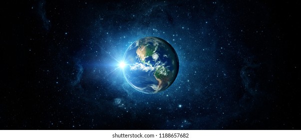 Panoramic view of the Earth, sun, star and galaxy. Sunrise over planet Earth, view from space. Stock Photo